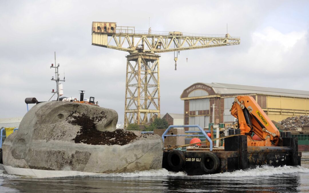 Giant Concrete and Steel Floating Head Sculpture Towed up the Clyde